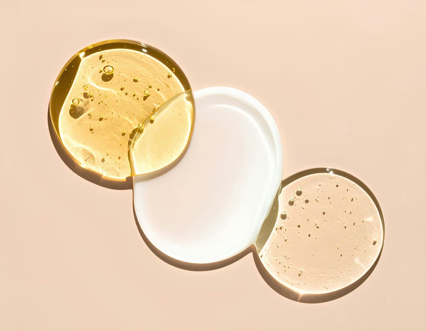 Serum and cream textures on a warm ground
